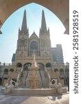 Beautiful Gothic-style church with a grand fountain