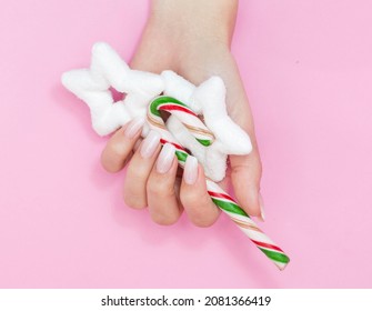 Beautiful gradient manicure  Christmas decorations in hands  New Year's manicure concept