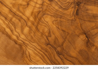 beautiful grain of a background made of olive wood - Shutterstock ID 2258392229