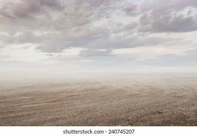 Beautiful gravel background with gravel mist and clouds in sunset 