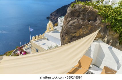 Beautiful greek belfry above the mediterranian sea at Fira town.The atmosphere of calm and relaxation at Santorini (Thira) island.Cyclades.Greece.Europe.