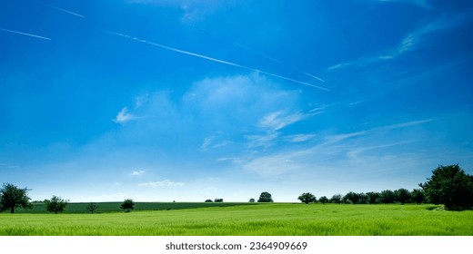 Beautiful Green Field and Blue Sky, 
Nature Landscape with Lush Greenery, 
Scenic Countryside View in Summer, 
Idyllic Rural Scene under Clear Skies, 
Tranquil Nature Background with Fields - Shutterstock ID 2364909669