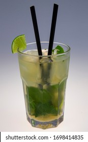 Beautiful Green Mochito With Black Straws And Lime