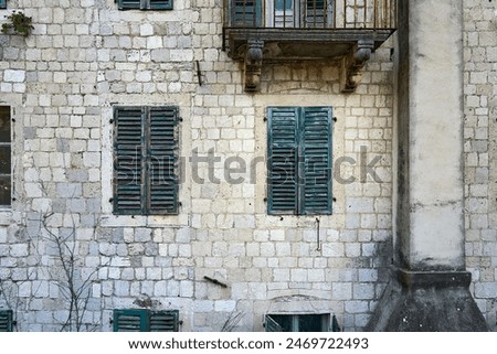 Similar – Image, Stock Photo Beautiful green old windows with matching color curtains and wooden shutters with slats of a renovated old building in the old town of Ghent in East Flanders in Belgium
