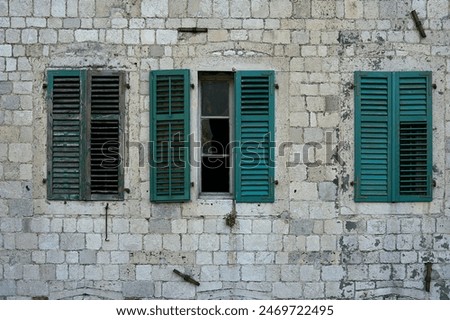 Similar – Image, Stock Photo Beautiful green old windows with matching color curtains and wooden shutters with slats of a renovated old building in the old town of Ghent in East Flanders in Belgium
