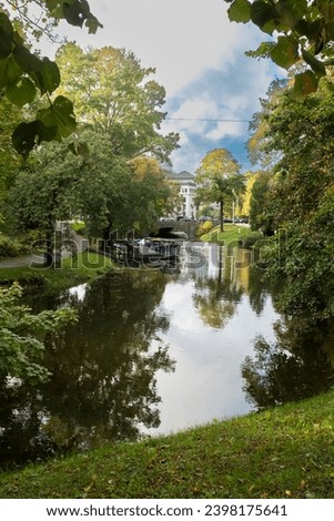 Beautiful green park with a flowing water canal in the city centre of Riga, Latvia