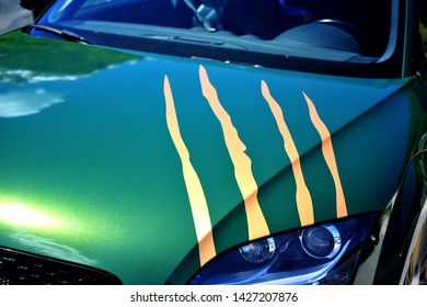 Beautiful Green Sport Car With Gold Scratches