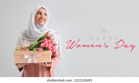 Beautiful Greeting Card For International Women's Day Celebration With Young Muslim Woman Holding Gift