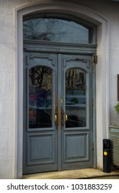 Beautiful grey round top vintage doors in an old european city