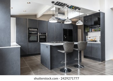 Beautiful grey slate and marble European style modern home kitchen. Elegant minimal home interior style decor. Luxury living standards at home. - Powered by Shutterstock