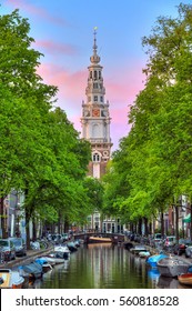 Beautiful Groenburgwal canal in Amsterdam with the Soutern church (Zuiderkerk) at sunset in summer