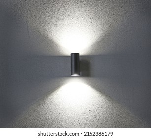 Beautiful group of modern wall lamps interior modern decoration, the lamp shines from the lamp along the wall, creating a gentle light and shadow before going to bed, does not blind the eyes - Shutterstock ID 2152386179
