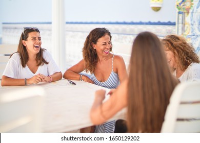 Beautiful Group Of Women Sitting At Terrace Speaking And Smiling