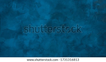 Beautiful grunge navy blue stucco wall background. Panoramic abstract decorative dark background. Wide angle rough stylized texture wallpaper with copy space for design.
