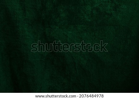 Beautiful grunge velvet dark ash green textured background. Wide dark dusty leafy banner or wallpaper rough styled with space for text and design. Uneven velvety vintage photography backdrop