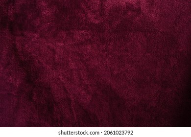 Beautiful grunge velvet dark aubergine textured background. Wide burgundy banner or wallpaper rough styled with space for text and design. Uneven velvety photography backdrop