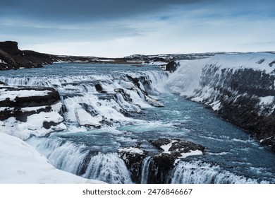 Beautiful Gullfoss waterfall flowing in Hvita river canyon during winter on gloomy day at Southwest Iceland - Powered by Shutterstock