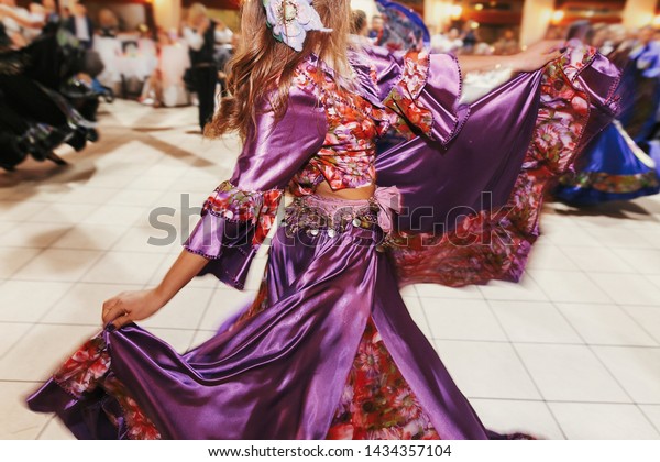 Beautiful Gypsy Girls Dancing Traditional Purple Royalty Free