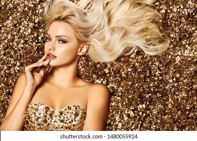 Beautiful hair Girl. Healthy Long Hair. Blonde woman in golden flowers garden, princes