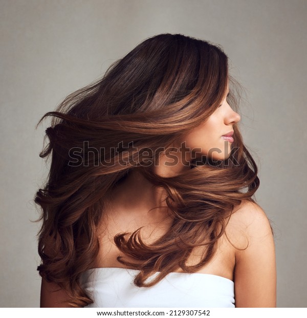 Beautiful Hair swinging head\
from side to side, Young beautiful woman with long perfect healthy\
lovely shiny hair, happy with beauty products, hair shampoo or\
conditioner