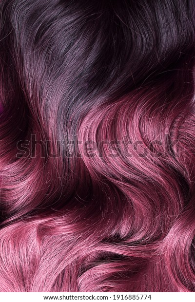 A beautiful hair wavy texture of ombre purple and\
violet synthetic wig
