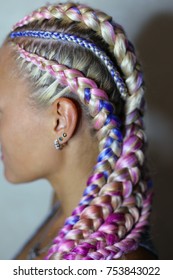 a beautiful hairstyle made of thick and thin braid on the head w