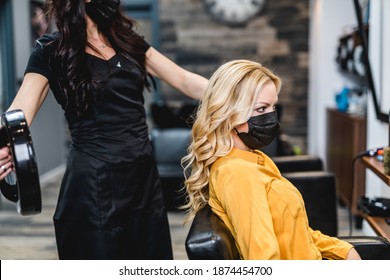 Beautiful Hairstyle Of Middle-aged Woman With Protective Face Mask After Dyeing Hair In Hair Salon.