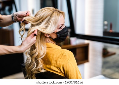 Beautiful Hairstyle Of Middle-aged Woman With Protective Face Mask After Dyeing Hair In Hair Salon.