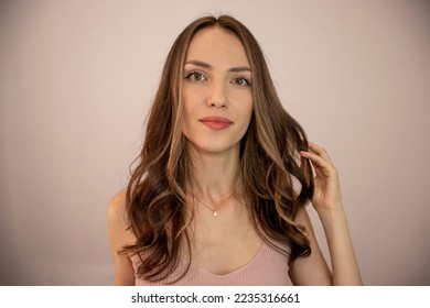 Beautiful hairstyle of young woman after dyeing hair and making highlights in hair salon. Hair bleaching technique Babylights, Balayage, Highlights, Lowlights, Ombre highlights