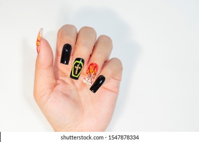 Beautiful Halloween Gel Nail Design Orange White Color Ombre Style Painting Cobweb Decorated Yellow Coffin And Golden Cross On Shiny Black Polish,fashion Nail Art Image Isolated On White Background