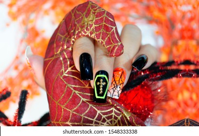 Beautiful Halloween Gel Nail Design Orange White Ombre Style Painting Cobweb Decorated Yellow Coffin And Golden Cross On Shiny Black Polish,fashion Nail Art Image Woman Hand Holding Red Cute Spider