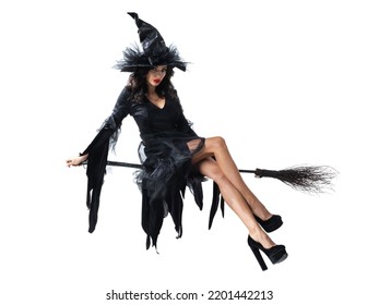 Beautiful Halloween witch flying on a broomstick isolated on white background - Shutterstock ID 2201442213