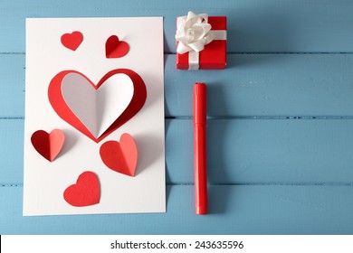 Beautiful Hand Made Post Card And Pen On Color Wooden Background