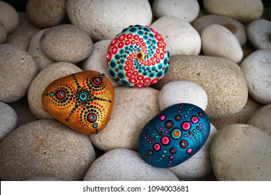 Beautiful Hand Painted Mandala Stones Lies On The Rocks