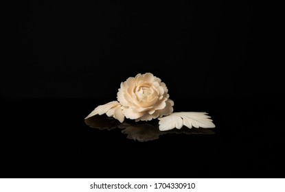 Beautiful Hand-Carved Ivory Flower and Leaves with Reflection