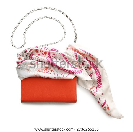 Beautiful handkerchief with pattern and bag isolated on white