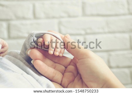 Similar – Baby sleeping on a blanket