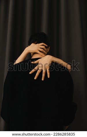 Similar – thin hands of an adult woman hugging a young girl