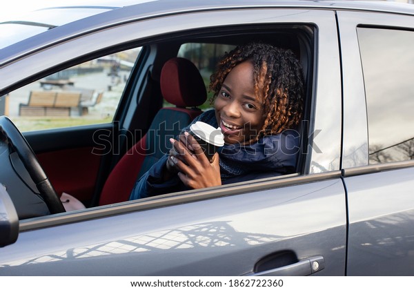 the\
beautiful and happy African American in the\
car
