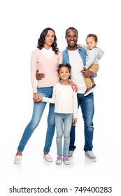 Beautiful Happy African American Family With Two Children Standing Together And Smiling At Camera Isolated On White 