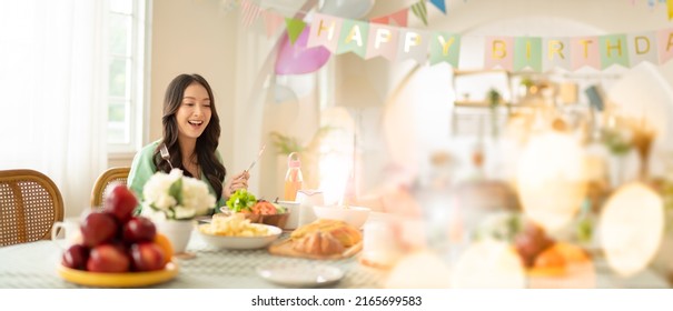 Beautiful Happy Asian Woman Her Birthday In Living Room At Home.Girl With Cake.Birthday Or New Year's Eve Celebration Concept