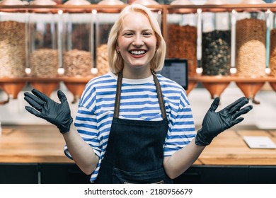 Beautiful Happy Blonde Woman Working At Health Food Store. Plastic Free Shop. Healthy Food Concept. 