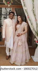 Beautiful Happy Couple All Dressed Up In Matching Pink Cultural Outfits On The Wedding Day