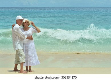 Beautiful Happy Elderly Couple Rest At Tropical Resort