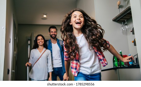 Beautiful Happy Excited Family With A Backpack And Suitcases In Modern Hotel