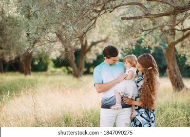 beautiful happy family in the olive grove in Montenegro - Powered by Shutterstock