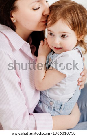 Similar – Image, Stock Photo Beautiful woman and her cute little daughter are hugging