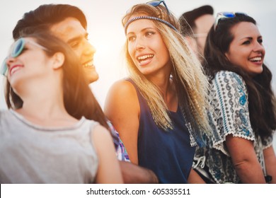Beautiful happy friends laughing and smiling outdoors - Shutterstock ID 605335511