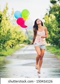 Beautiful Happy Girl Holding Balloons 