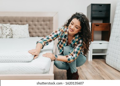 Beautiful And Happy Middle Age Woman Choosing New Bed And Mattress In Big Furniture Store